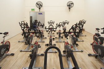 Interior. View of "spin'' class bikes within former squash court.