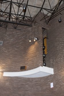 Interior. View of cantilevered lighting booth within the side wall of the theatre auditorium.