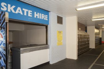 Interior. Detail of Skate hire station and lockers within ice rink.