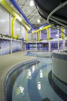 Interior. View looking west across the extension to the swimming pool hall.