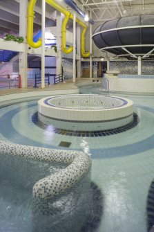 Interior. View looking east within the extension of the swimming pool hall with the structural columns of the original back wall to left.