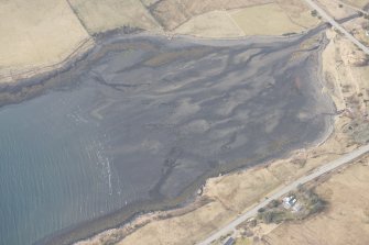 Oblique aerial view of the fish traps at Caroy, looking NW.