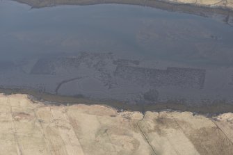 Oblique aerial view of the fish trap and kelp grids at River Snizort, looking E.