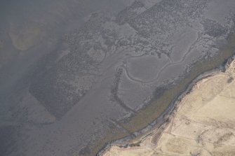 Oblique aerial view of the fish traps and kelp grids at River Snizort, looking SE.