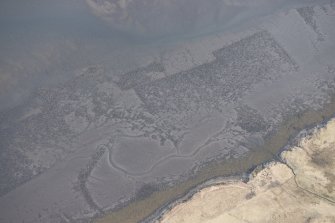 Oblique aerial view of the fish traps and kelp grids at River Snizort, looking SE.