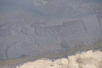 Oblique aerial view of the fish traps and kelp grids at River Snizort, looking E.