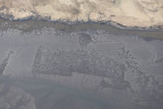 Oblique aerial view of the fish traps and kelp grids at River Snizort, looking W.