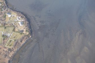Oblique aerial view of the remains of the kelp grids and fish trap in Loch Portree, looking to the N.