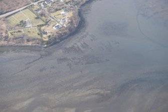 Oblique aerial view of the remains of the kelp grids and fish trap in Loch Portree, looking to the NW.