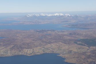 General oblique aerial view with Sleat in the foreground and Loch Eishort and the Cullins beyond, looking WNW.