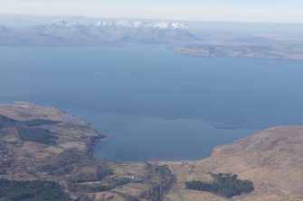 General oblique aerial view of Applecross Bay with Skye in the distance, looking WSW.