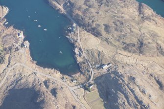 Oblique aerial view of Ardleshaig centred on the remains of the fish trap, looking N.
