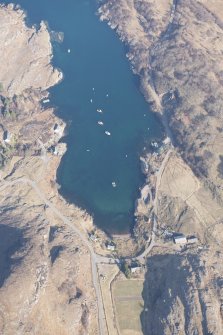 Oblique aerial view of Ardleshaig centred on the remains of the fish trap, looking NNW.