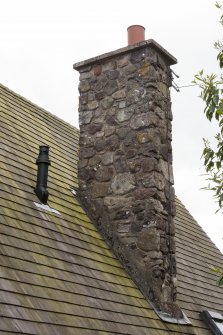 Detail of chimney and roof shingles.