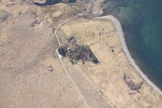 Oblique aerial view of the farmstead, field boundaries and cultivation, looking ENE.