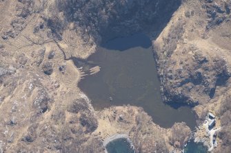 Oblique aerial view of the buildings, weir and nausts at Lochan Sal, looking SSE.