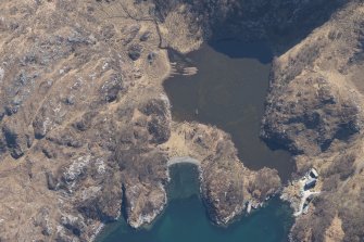 Oblique aerial view of the buildings, weir and nausts at Lochan Sal, looking SE.