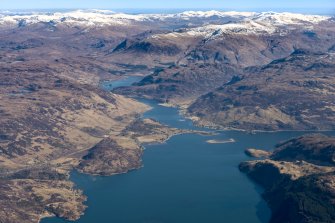 General oblique aerial view of Loch Alsh with Eilean Donan in the distance, looking E.