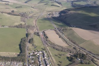 Oblique aerial view of Fountainhall showing construction of the Borders Railway Line, looking NW.