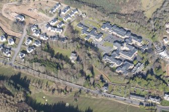 Oblique aerial view of Dingleton, Melrose, looking W.