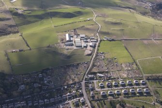 Oblique aerial view of Wellogate Farm, Hawick, looking SE.