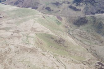 Oblique aerial view of Peelinick with the linear earthwork in the foreground, looking NE.