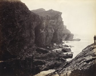 Wide view of rock formations and surrounding sea, on the beach of Kilchattan, Colonsay.
Titled: '151. Behind Kilchattan, Colonsay.'
PHOTOGRAPH ALBUM NO 186: J B MACKENZIE ALBUMS vol.1