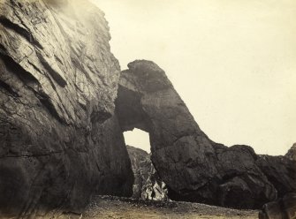 View of Uamh Bantighearna Cave entrance near Kiloran Bay, Colonsay.
Titled: '72. Uamh Shrideach. Cave near Kiloran Beach.'
PHOTOGRAPH ALBUM NO 186: J B MACKENZIE ALBUMS vol.1