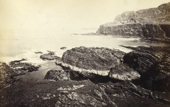 View of rock formations on the beach of Kilchattan, Colonsay.
Titled: '76. Rocks at the back of Kilchattan, Colonsay.'
PHOTOGRAPH ALBUM NO 186: J B MACKENZIE ALBUMS vol.1