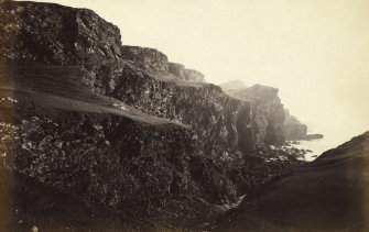 View of rock formations on the beach of Kilchattan, Colonsay.
Titled: '78. Rocks behind Kilchattan, Colonsay.'
PHOTOGRAPH ALBUM NO 186: J B MACKENZIE ALBUMS vol.1