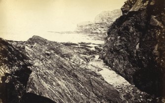 View of rock formations on the beach of Kilchattan, Colonsay.
Titled: '79. Rocks behind Kilchattan, Colonsay.'
PHOTOGRAPH ALBUM NO 186: J B MACKENZIE ALBUMS vol.1