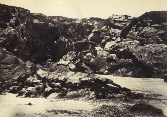 Wide view of cave situated on the West side of Kiloran Bay, Colonsay.
Titled: '31. Dark Cave at West Side of Kiloran Beach.'
PHOTOGRAPH ALBUM NO 186: J B MACKENZIE ALBUMS vol.1