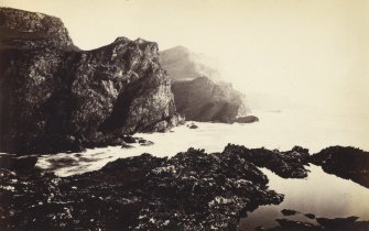 Wide view of rock formations on the beach of Kilchattan, Colonsay.
Titled: '80. Rocks behind Kilchattan, Colonsay.'
PHOTOGRAPH ALBUM NO 186: J B MACKENZIE ALBUMS vol.1