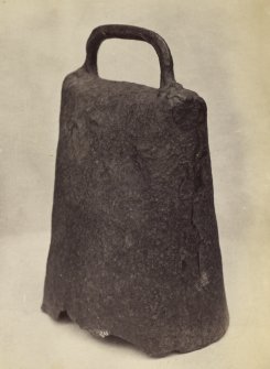 View of a 7th century Celtic hand bell descovered at Fortingall Manse, now situated on display in Fortingall Church.
Titled: 'Celtic Bell at Fortingall Manse.'​
PHOTOGRAPH ALBUM NO 186: J B MACKENZIE ALBUMS vol.1
