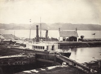 View of the 'Linnet' steamship at Crinan Harbour on Loch Crinan, North Knapdale.
Titled: '40. "Linnet" at Crinan.' 
PHOTOGRAPH ALBUM, NO 186: J B MACKENZIE ALBUMS vol.1