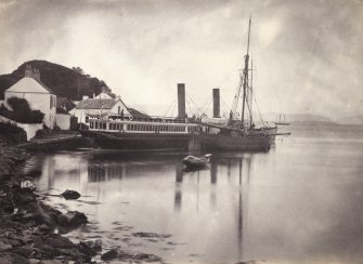 Wide view of steamship known as 'Chavalier' moored at Crinan Harbour, Crinan Loch, North Knapdale.
Titled: '42. "Chevalier" at Crinan.'
PHOTOGRAPH ALBUM, NO 186: J B MACKENZIE ALBUMS vol.1