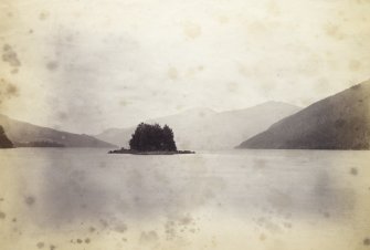 View, wide-angle, of Loch Tay with small island situated in the centre, at Kenmore, Perth.
PHOTOGRAPH ALBUM No. 187, (cf PAs 186 and 188) Rev. J.B. MacKenzie of Colonsay Albums,1870, vol.2.
