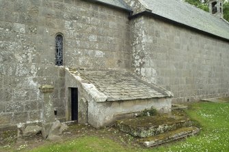 Covered entrance on north side of church from north east.