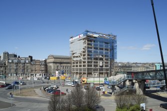 Exterior. View of the demolition of Tayside House in progress taken from the south west, on the raised external concourse of the Olympia Centre.