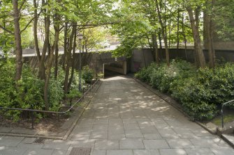 View from the north west looking down the sloping path to the underpass entrance of St George's Cross subway station entrance concourse