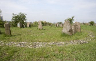 View looking west across the northern half of the Sighthill Stone Circle, with the cobbled boundary path to the foreground