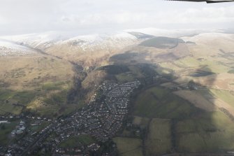 General oblique aerial view of the Glen of Sorrow and Tarmangie Hill with Dollar in the foreground, looking N.