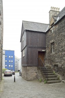 General view of timber jettied house in Bakehouse Close, 146 Canongate, Edinburgh, from NW.