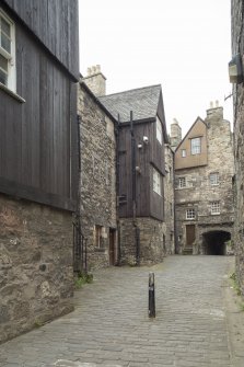 General view of timber jettied houses in Bakehouse Close, 146 Canongate, Edinburgh, from SW.