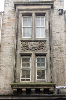 Detail of carved panel above entrance to Sugarhouse Close at 160 Canongate, Edinburgh.