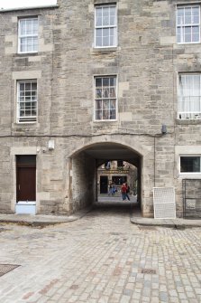 View of arched pend leading from Canongate to Sugarhouse Close, Edinburgh, from S.