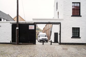 View of gates between former brewery buildings in Sugarhouse Close (off Canongate), Edinburgh, from N.