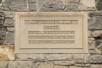 Detail of carved panel giving details of Tobias George Smollett at Smollett's Lodging, St John Street, Edinburgh, St John Street elevation above pend from Canongate.