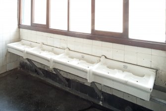 Interior. Detail of sinks in ground floor cloakroom.