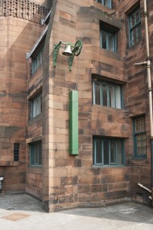 Exterior. Detail of school bell mechanism on west wall.